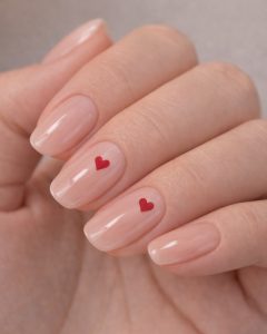 Valentine Nails with clear coffin nails, red heart confetti design, red glitter accents, glossy finish, Top Nails 3