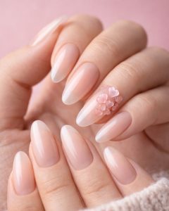 Valentine Nails and February nails at Top Nails 3, long coffin nails with bold red tips, heart print accent, red glitter statement nail