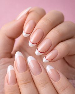 Valentine Nails and February nails at Top Nails 3, nude short oval nails with tiny red heart accents, glossy natural finish