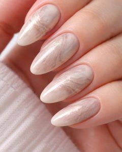 Soft marble almond nails with pearl shimmer and glossy finish, International Women’s Day Nail Trends 2026 Top Nails 3