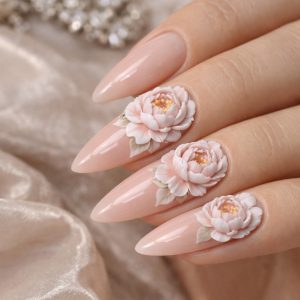 Soft nude almond nails with sculpted pink 3D flower nails and gold center details at Top Nails 3 Airdrie 