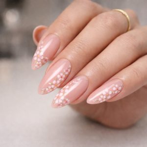 Nude pink almond nails with delicate cherry blossom floral art Floral Nails 2026 at Top Nails 3 Airdrie