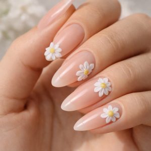 Natural nude almond nails with daisy 3D flower nails accents at Top Nails 3 Airdrie Title: