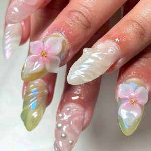 Long iridescent nails with sculpted 3D flower petals and pearl accents Floral Nails 2026 at Top Nails 3 Airdrie