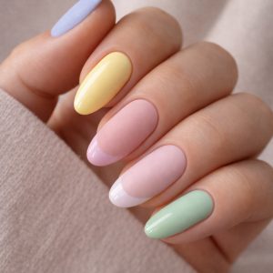 Pastel mix texture nails with matte and glossy finishes in yellow, pink, mint, and lilac on almond-shaped nails at Top Nails 3 Airdrie