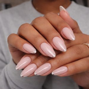 Minimalist French tip mix texture nails with sheer pink base and glossy white tips on almond-shaped nails at Top Nails 3 Airdrie